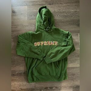 Supreme Forest Green Hoodie with Vibrant Logo